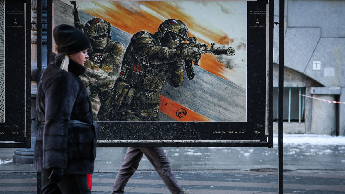 ST  PETERSBURG, RUSSIA - 2025/02/20: People walk past a poster depicting Russian servicemen at an exhibition dedicated to the special military operation in Ukraine on Bolshaya Morskaya Street. (Photo by Artem Priakhin/SOPA Images/LightRocket via Getty Images)