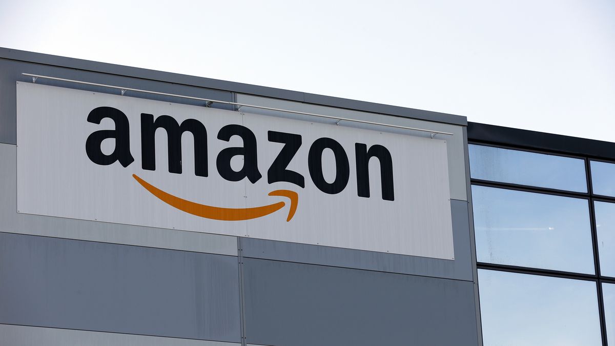 VELIZY-VILLACOUBLAY, FRANCE - NOVEMBER 20: The logo of Amazon is seen on the facade of its  warehouse on November 20, 2020 in Velizy-Villacoublay near Paris, France. General Manager of Amazon France, Frédéric Duval, announced the postponement of Black Friday from November 27 to December 4. "Today, like other large French distributors and taking into account the recommendation of the French Government, we have decided to postpone Black Friday if this allows businesses to reopen before December 1 and therefore this year, Black Friday will take place on December 4. " Amazon France confirmed in a statement. (Photo by Chesnot/Getty Images)