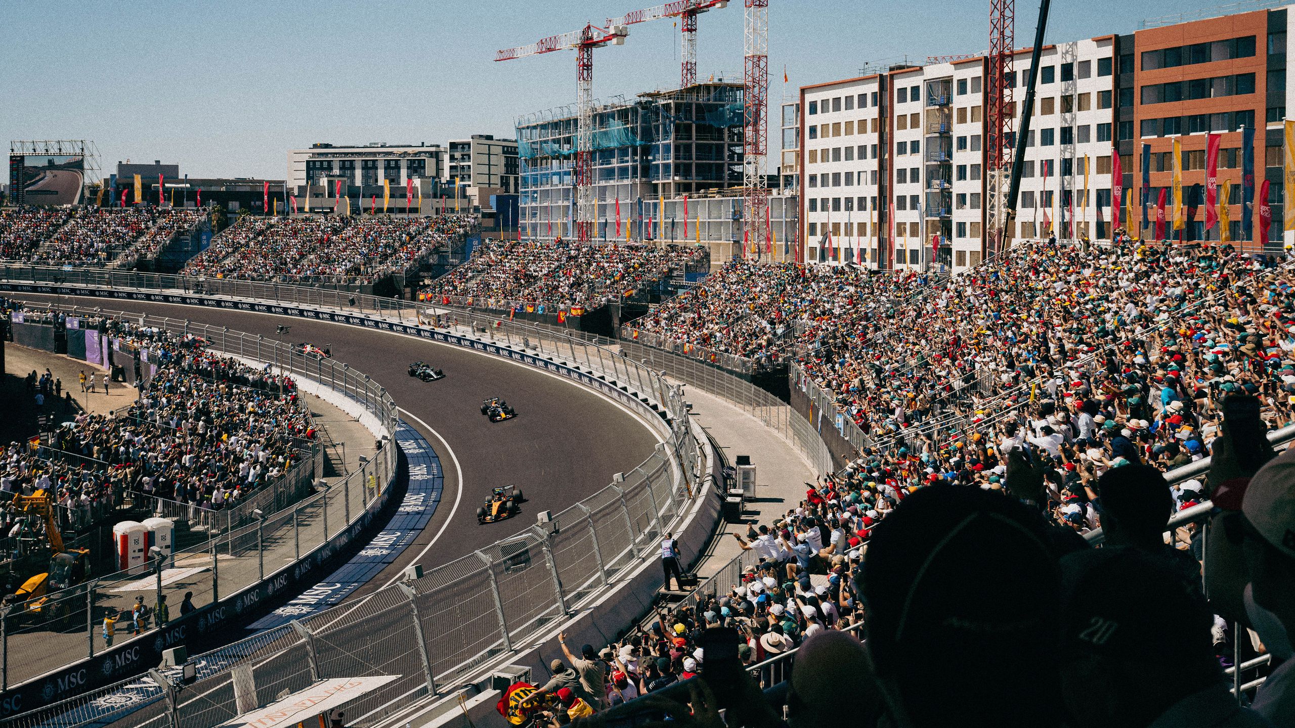 MADRID, SPAIN - SEPTEMBER 13: (EDITORS NOTE: Image has been digitally enhanced.) Lando Norris of Great Britain driving the (1) McLaren MCL40 Mercedes, leads  Max Verstappen of the Netherlands driving the (3) Oracle Red Bull Racing RB22 Red Bull Ford Powertrains and Andrea Kimi Antonelli of Italy driving the (12) Mercedes AMG Petronas F1 Team W17 on track during the F1 Grand Prix of Spain at Madring on September 13, 2026 in Madrid, Spain. (Photo by Pauline Ballet - Formula 1/Formula 1 via Getty Images)