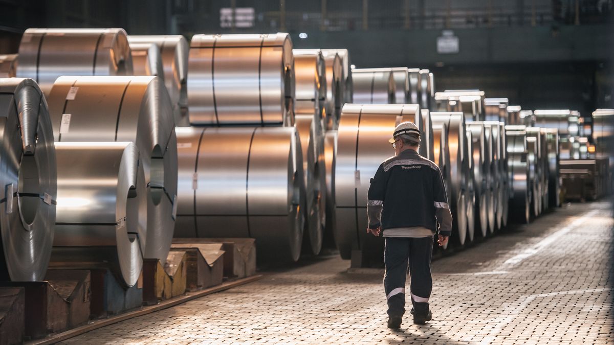 DUISBURG, GERMANY - MARCH 20: A worker walks past coils of finished steel at the Thyssenkrupp steel mill on March 20, 2025 in Duisburg, Germany. The European Commission is enacting its European Steel Action Plan in an effort to restore competitiveness to the European steel sector, which has been hobbled by high energy costs and faces stiff competition from abroad, particularly in Asia. The recent introduction of tariffs by the administration of U.S. President Donald Trump on steel and aluminum imports is a further setback. (Photo by Hesham Elsherif/Getty Images)