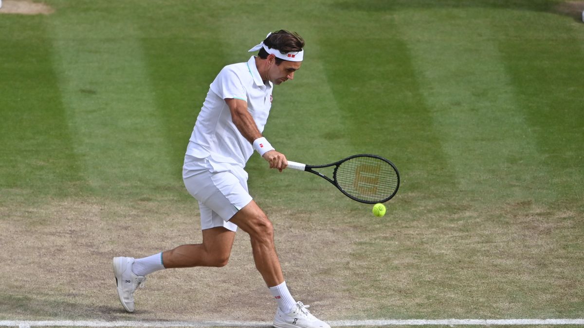 LONDON, ENGLAND - JULY 07: Roger Federer of Switzerland hits a backhand against Hubert Hurkacz of Poland in the quarter finals of the gentlemen's singles during Day Nine of The Championships - Wimbledon 2021 at All England Lawn Tennis and Croquet Club on July 07, 2021 in London, England. (Photo by TPN/Getty Images)