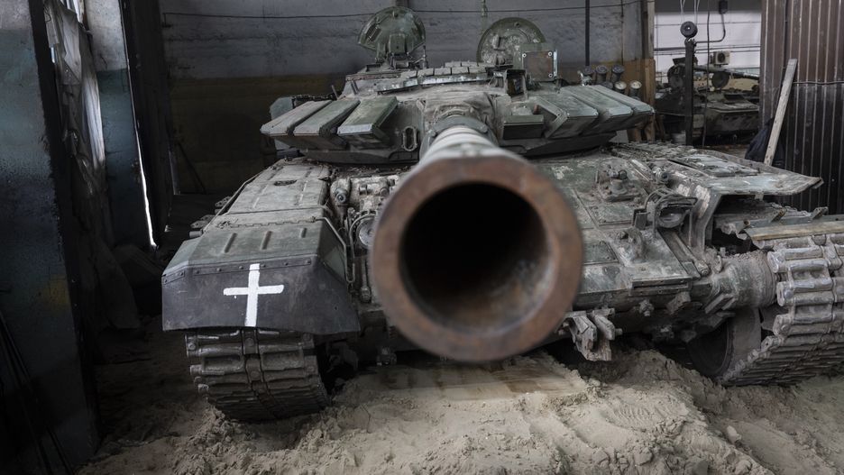 EASTERN UKRAINE - FEBRUARY 13:  A captured Russian T-72B3 tank awaits repairs on February 13, 2023 at a warehouse in eastern Ukraine. The Ukrainian crowdfunding organization Serhiy Prytula Charity Foundation funds the facility which refurbishes tanks and armored vehicles captured on the battlefield from retreating Russian forces. Such "trophy" vehicles have been crucial to resupply Ukrainian forces who often rely on older Soviet-era fleets, increasingly augmented by newer western weapons systems. (Photo by John Moore/Getty Images)