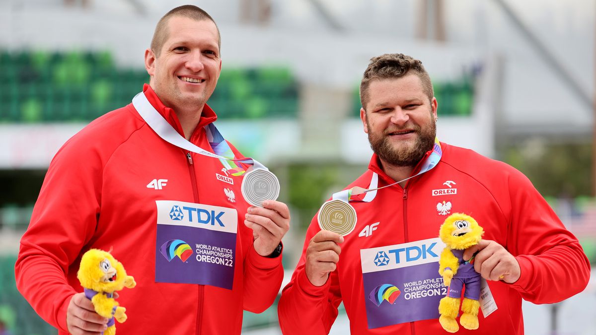EUGENE, OREGON - JULY 16: Silver medalist Wojciech Nowicki of Team Poland and gold medalist Pawel Fajdek of Team Poland pose during the medal ceremony for the Men’s Hammer Throw Final on day two of the World Athletics Championships Oregon22 at Hayward Field on July 16, 2022 in Eugene, Oregon. (Photo by Andy Lyons/Getty Images for World Athletics)