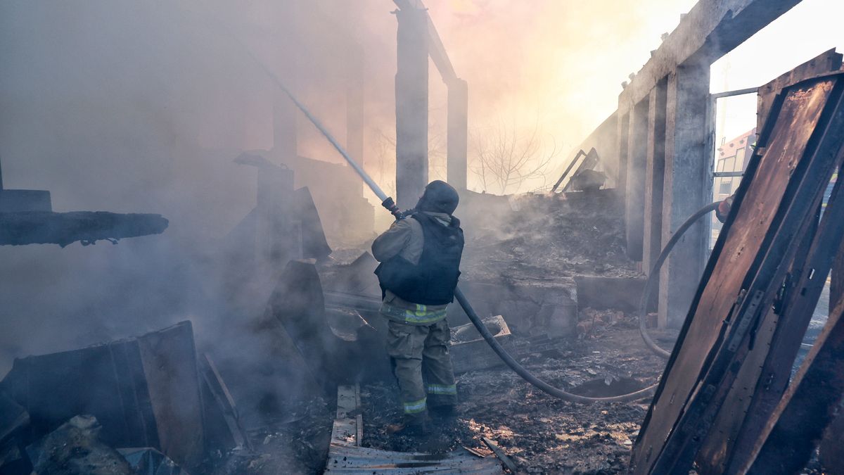 A firefighter pours water from a hose to suppress a fire caused by a Russian strike in Odesa, Ukraine, on December 13, 2025. During the night of December 13, Russian forces launch more than 450 attack drones and around 30 missiles of various types across Ukraine. In Odesa and the region, the strikes target energy, port, gas, industrial, and civilian infrastructure. (Photo by Nina Liashonok/Ukrinform/NurPhoto via Getty Images) NO USE RUSSIA. NO USE BELARUS. (Photo by Ukrinform/NurPhoto via Getty Images)