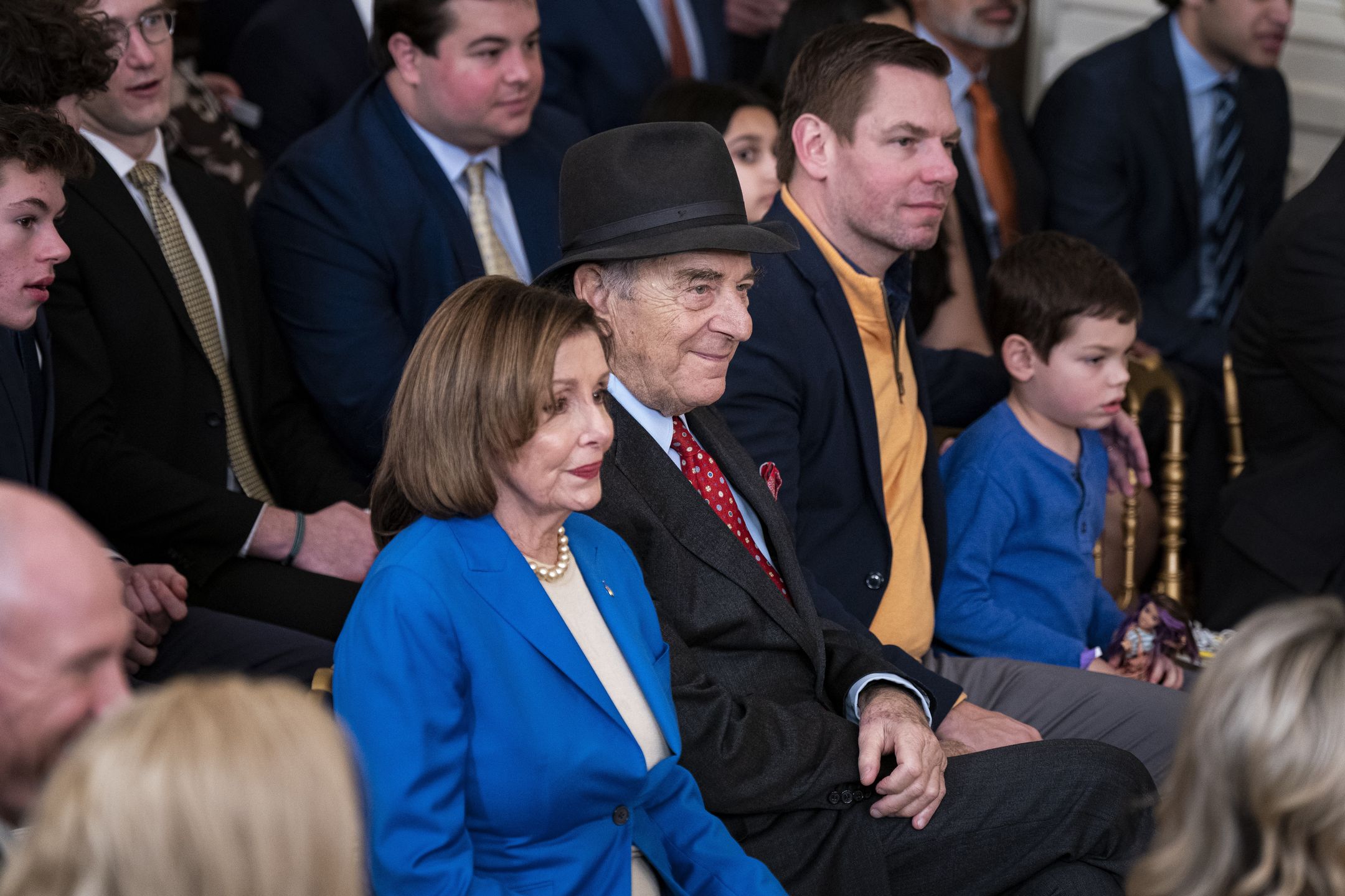 Representative Nancy Pelosi, a Democrat from California, and her husband Paul Pelosi, center, during an event hosting the Golden State Warriors in the East Room of the White House in Washington, DC, US, on Tuesday, Jan. 17, 2023. President Biden is honoring the team to celebrate their 2022 NBA championship against the Boston Celtics. Photographer: Al Drago/Bloomberg via Getty Images