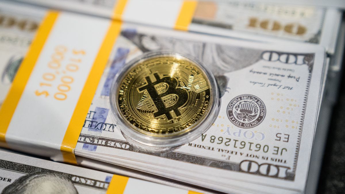 A novelty Bitcoin token during the NFT.NYC 2024 conference in New York, US, on Wednesday, April 3, 2024. NFTs, which went from being touted as the cutting edge of the digital frontier to the punchline for the most recent crypto bust, are suddenly staging an unlikely comeback following global sales volume for NFTs plummeted 63% to $8.7 billion last year, according to data from CryptoSlam. Photographer: Timothy Fadek/Bloomberg via Getty Images