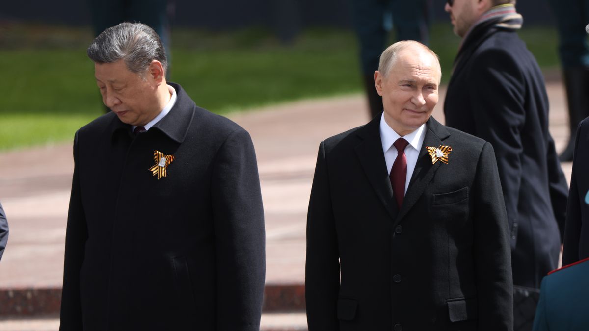 MOSCOW, RUSSIA - MAY 9 (RUSSIA OUT) Russian President Vladimir Putin (R) smiles as Chinese President Xi Jinping (L) grimases during the wreath laying ceremony to the Unknown Soldiers' Tomb, marking the 80th anniversary of the victory over Nazi's Germany, May 9, 2025 in Moscow, Russia. President Putin has welcomed Chinese Leader Xi Jinping in Moscow for a four-day visit centred aroind Russia's 'Victory Day' celebrations, commemorated the end of the World War II. The trip marsk Xi's eleventh trip to Russia since becoming president. (Photo by Contributor/Getty Images)