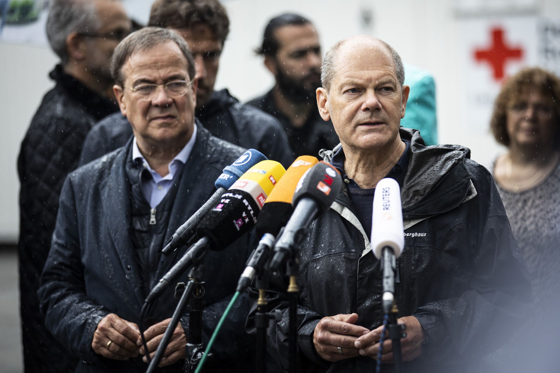 STOLBERG, GERMANY - AUGUST 03: German Finance Minister Olaf Scholz (R) and Armin Laschet, prime minister of the German state of North Rhine-Westphalia and Chairman of the CDU, are pictured during a press statement after their visit at the flood-stricken city Stolberg on August 03, 2021 in Stolberg, Germany. (Photo by Florian Gaertner/Photothek via Getty Images)