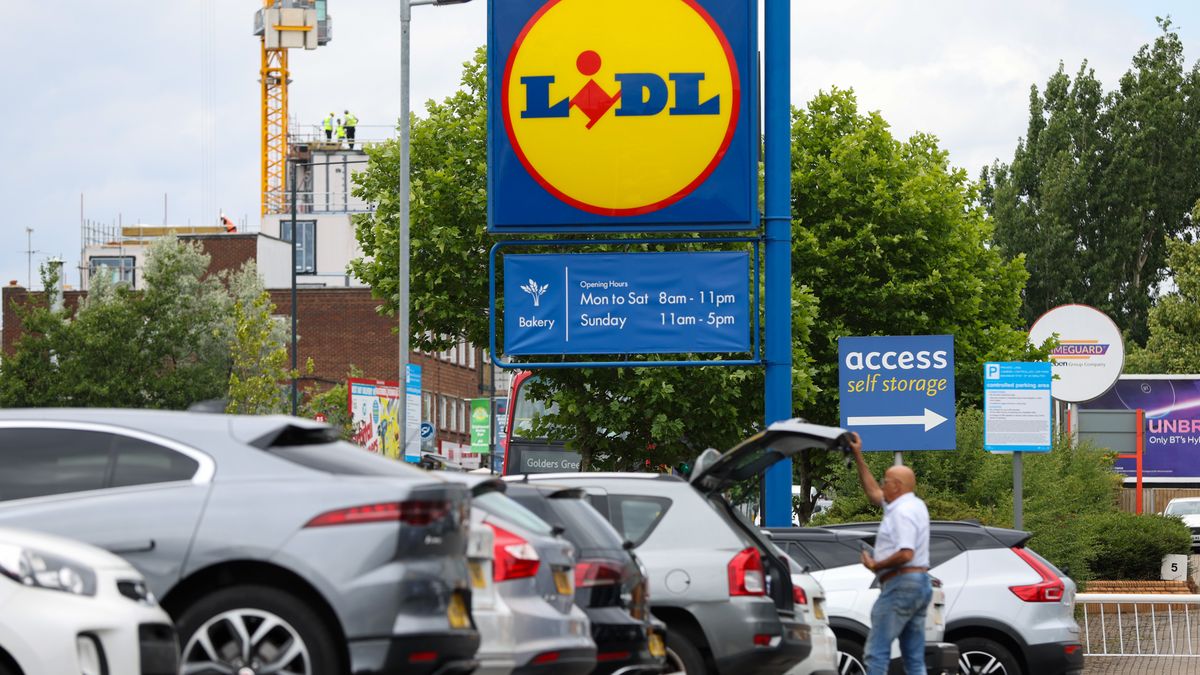A customer loads a car boot with groceries from a Lidl Ltd. supermarket in London, UK, on Friday, June 24, 2022. The Office for National Statistics said Friday the volume of goods sold in stores and online fell 0.5% in May, as soaring food prices forced consumers to cut back on spending in supermarkets. Photographer: Hollie Adams/Bloomberg via Getty Images