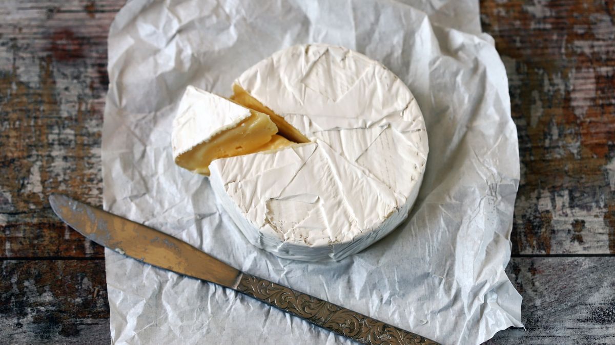 Fresh Camembert cheese in the paper.
Camembert cheese in the white paper. Fresh Camembert cheese. Selective focus.
Oksana Shyriaieva