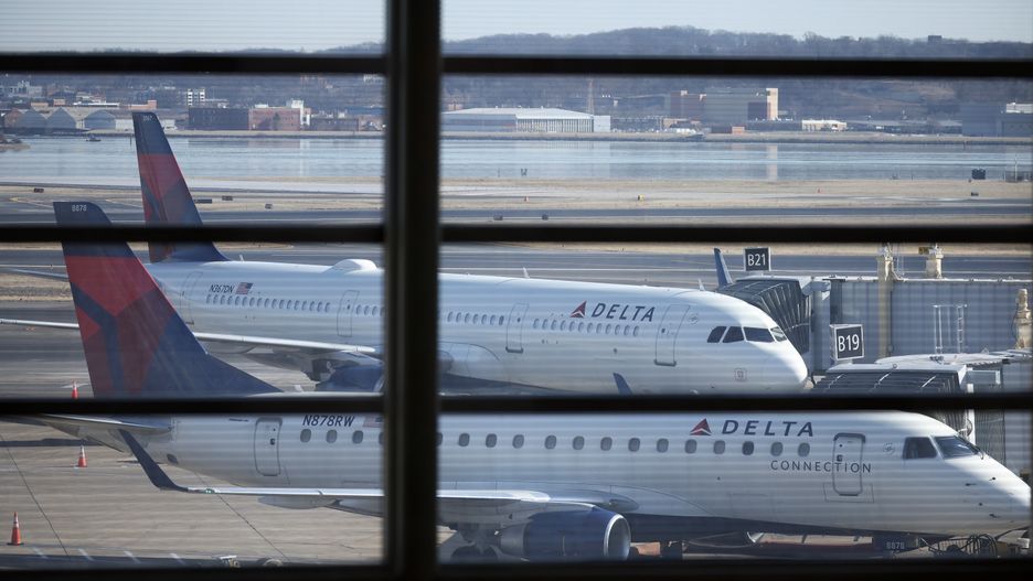 ARLINGTON, VIRGINIA - JANUARY 30: Delta airlines planes are parked at their gates at the Reagan National Airport as the investigation continues into the crash last night of an American Airlines plane on the Potomac River as it approached Reagan National Airport on January 30, 2025 in Arlington, Virginia. The American Airlines flight from Wichita, Kansas collided in midair with a military helicopter while approaching Ronald Reagan National Airport. According to reports there were no survivors amongst the 67 people on board both aircraft. (Photo by Tasos Katopodis/Getty Images)