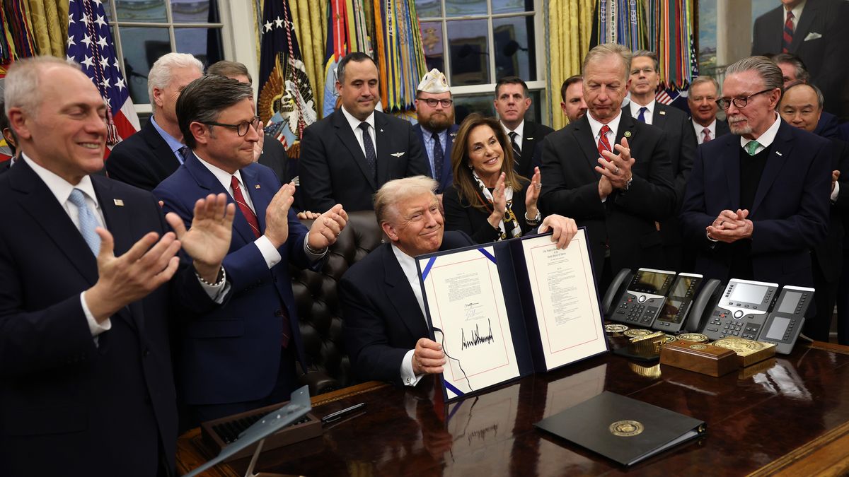 WASHINGTON, DC - NOVEMBER 12: U.S. President Donald Trump signs funding legislation to reopen the federal government as he is joined by House Speaker Mike Johnson (R-LA), House Minority Leader Steve Scalise (R-LA), Republican lawmakers and business leaders, during a ceremony in the Oval Office of the White House on November 12, 2025, in Washington, DC. The legislation, passed by the House of Representatives tonight, funds the federal government until the end of January 2026 and ends the 43-day government shutdown, the longest in the nation’s history. (Photo by Win McNamee/Getty Images)