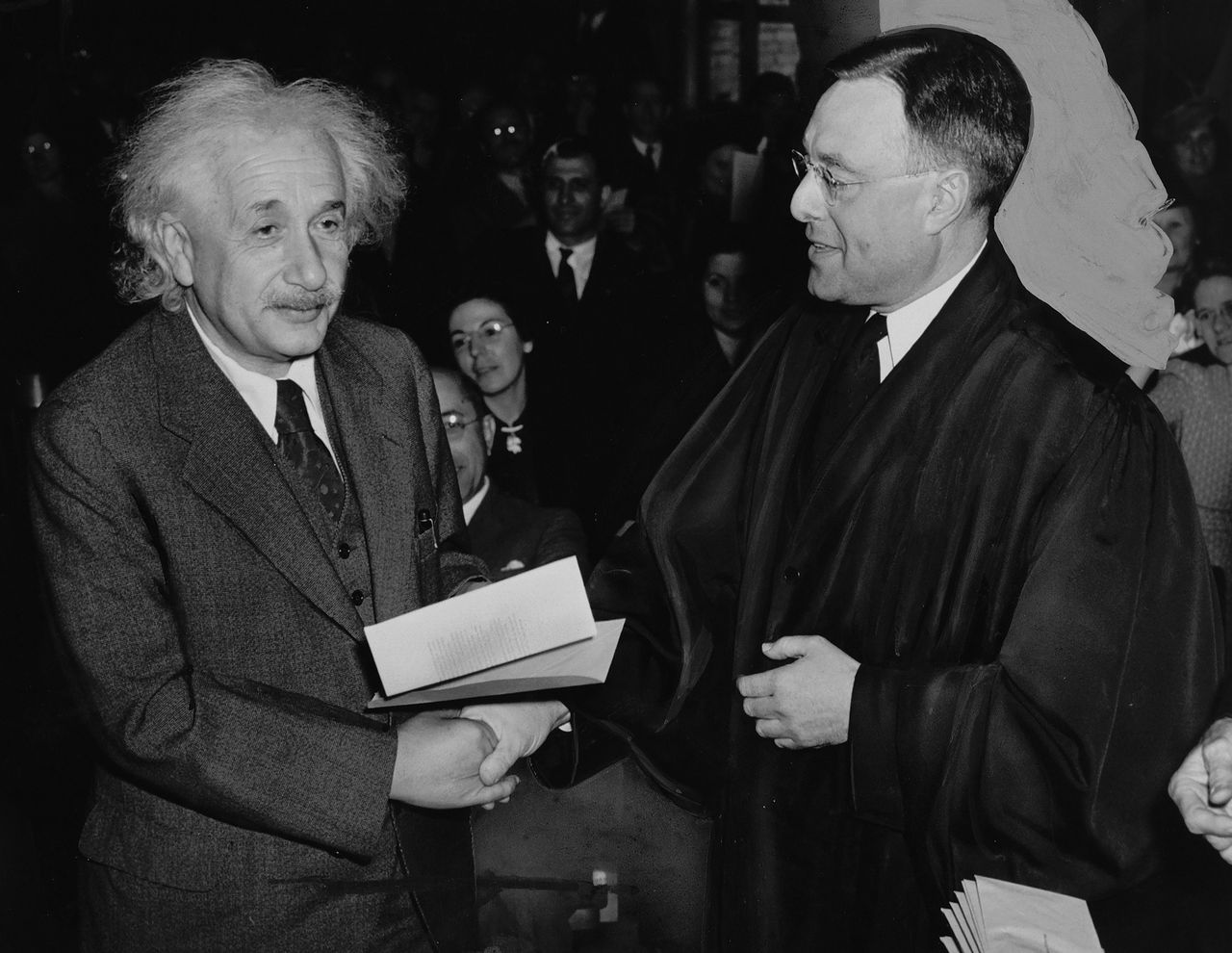 Albert Einstein receives a certificate of American citizenship from Judge Phillip Forman, October 1, 1940.