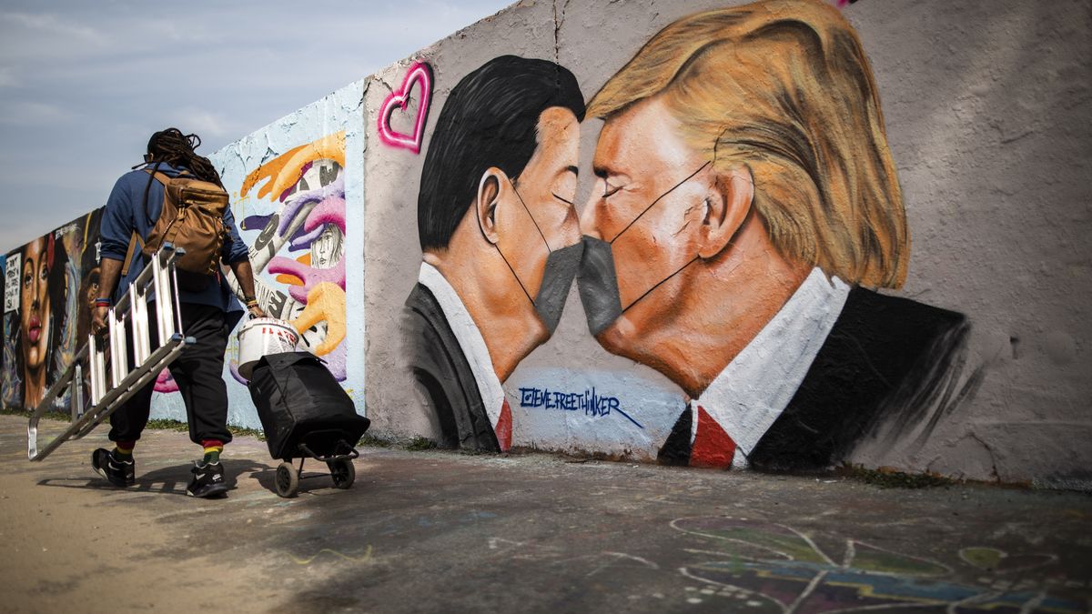 BERLIN, GERMANY - APRIL 28: A graffiti shows Donald Trump, President of the United States of America, and Xi Jinping, President of People's Republic of China, with face masks on April 28, 2020 in Berlin, Germany. (Photo by Florian Gaertner/Photothek via Getty Images)