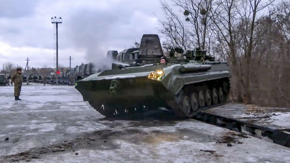 arch49In this photo taken from video provided by the Russian Defense Ministry Press Service, A Russian armored vehicle drives off a railway platform after arrival in Belarus, Wednesday, Jan. 19, 2022. In a move that further beefs up forces near Ukraine, Russia has sent an unspecified number of troops from the country's far east to its ally Belarus, which shares a border with Ukraine, for major war games next month. (Russian Defense Ministry Press Service via AP)Russian Defense Ministry Press Service