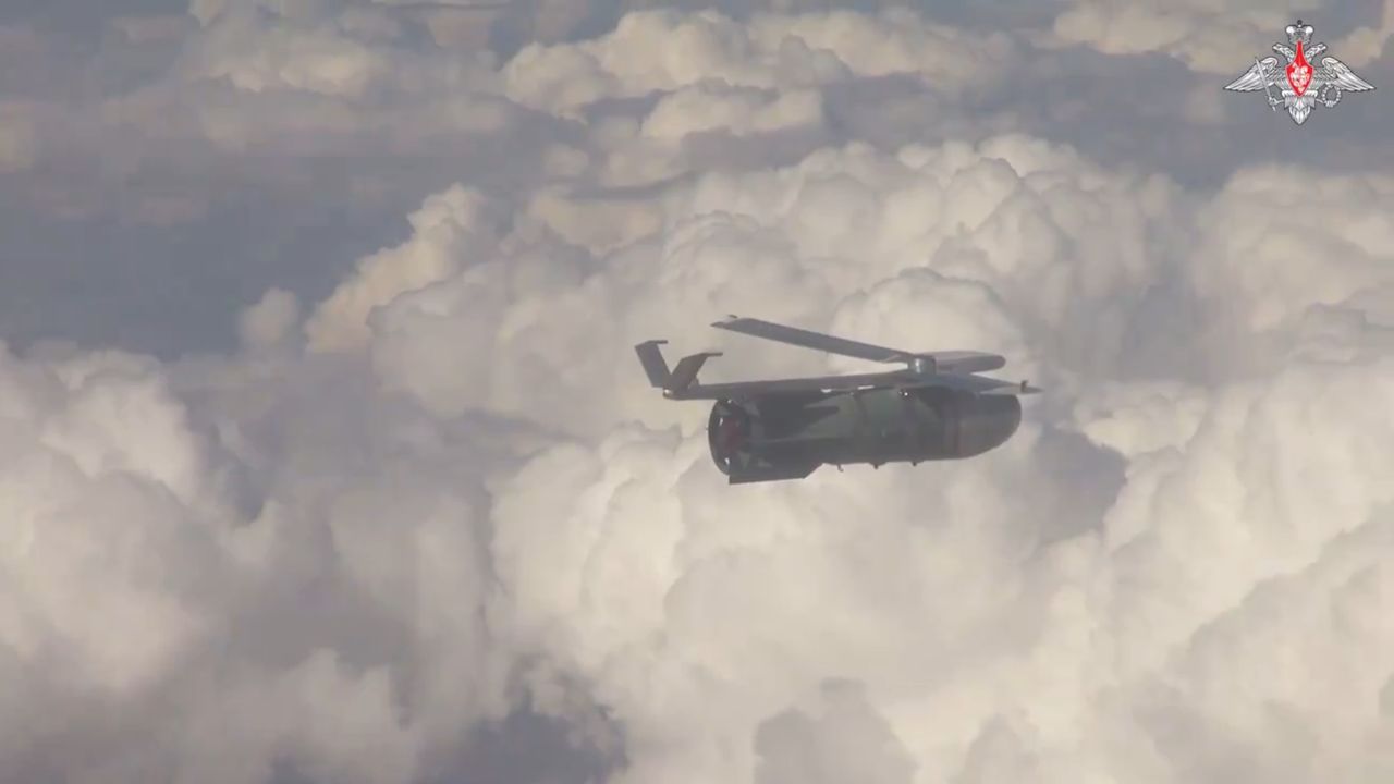 A Su-34 pilot observing a FAB-3000 bomb in flight with a UMPK module.