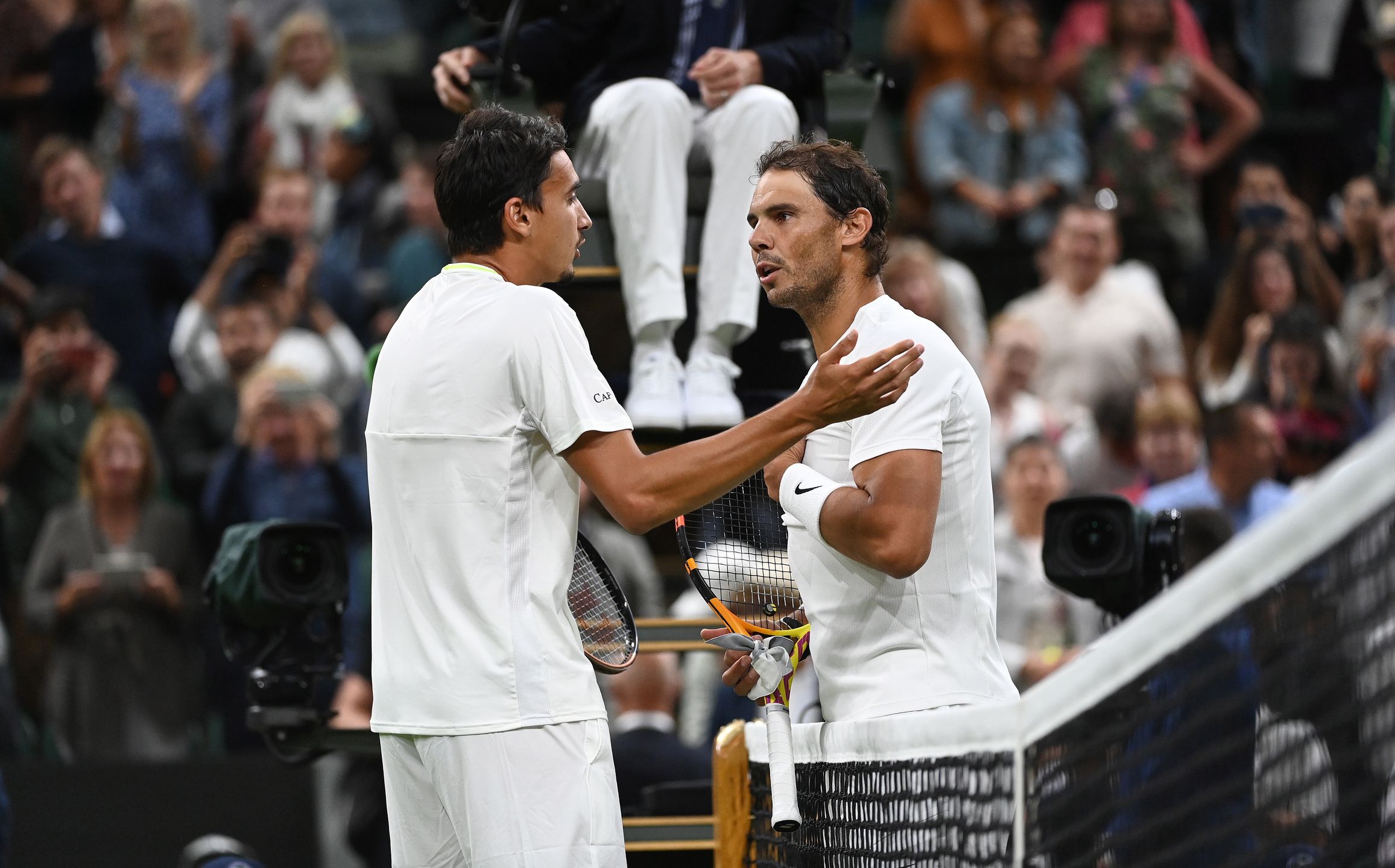 Rafael Nadal of Spain (R) has a long and animated discussion at the net after defeating Lorenzo Sonego of Italy (L) during their Men's third round match at the Wimbledon Championships, in Wimbledon, Britain, 02 July 2022. EPA/ANDY RAIN EDITORIAL USE ONLY Dostawca: PAP/EPA.