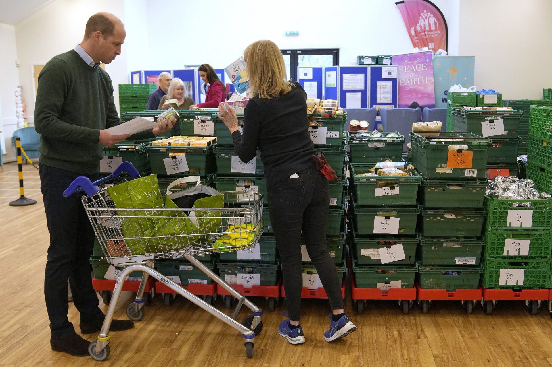 Britain's Kate, Princess of Wales, and Prince William collect food during a visit to Windsor Foodshare in Windsor, Thursday, Jan. 26, 2023. The Prince and Princess of Wales learned more about the support that the organisation provides to individuals and families living in the local area, before helping volunteers to sort food donations and prepare packages for the charity's clients., Credit:Avalon.red / Avalon