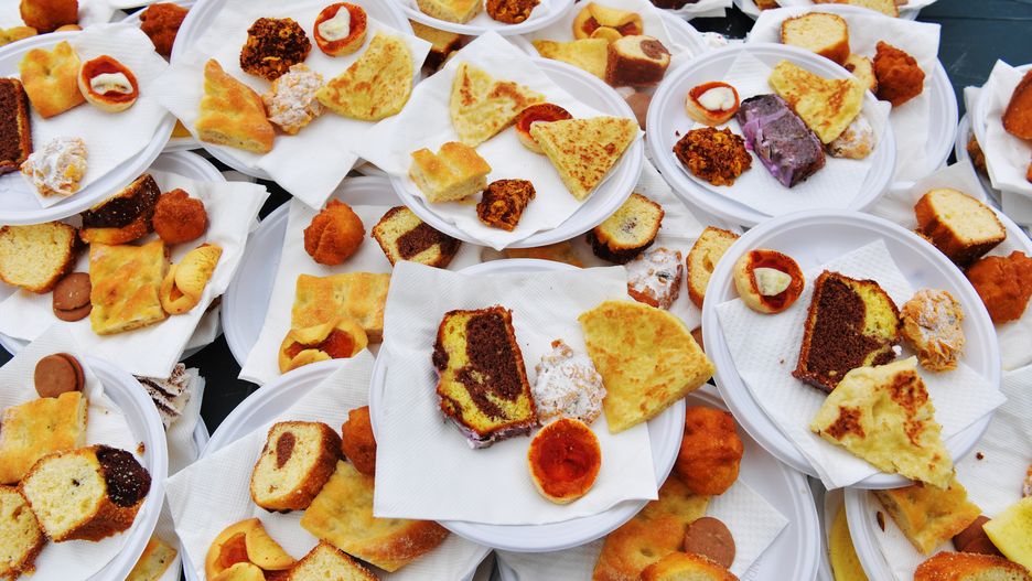 LIVORNO, ITALY - APRIL 10: Dishes with typical Ramadan food such as sweets, cakes and bread are seen during the celebration for the end of Ramadan of the Islamic Community of Livorno, on April 10, 2024 in Livorno, Italy. The Muslim festival of Eid al-Fitr celebrates the end of the holy month of Ramadan and has been decreed as Wednesday 10th April. The dates of Eid al-Fitr are established on the final day of Ramadan following the crescent moon's arrival in Arab Islamic countries.(Photo by Laura Lezza/Getty Images)
