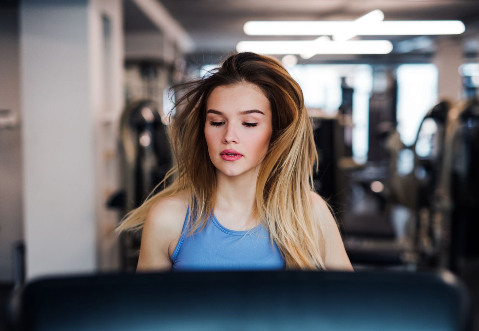 A portrait of young girl or woman doing cardio workout in a gym.
A portrait of a beautiful young girl or woman doing cardio workout in a gym.
Halfpoint