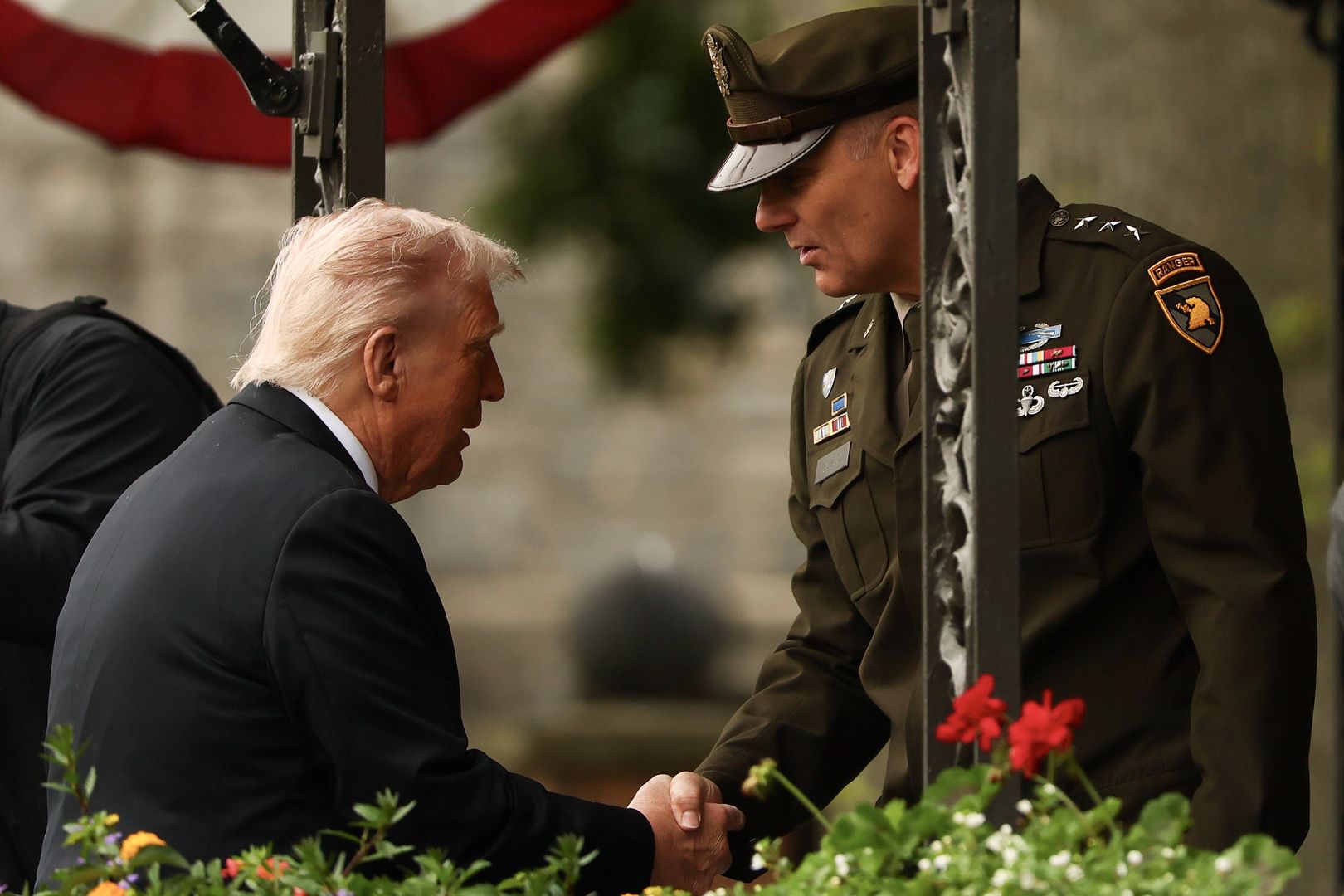 WEST POINT, NEW YORK - MAY 24: President Donald Trump shakes hands with United States Military Academy West Point superintendent Lieutenant General Steven W. Gilland prior to addressing graduates in Michie Stadium on May 24, 2025 in West Point, NY. Over one thousand cadets are expected to graduate in the same year that the U.S. Army celebrates its 250th birthday. This year's graduating class included honorary member Peter Wang, a junior ROTC cadet who was killed in the 2018 mass shooting at Marjory Stoneman Douglas High School in Parkland, Florida. (Photo by Michael M. Santiago/Getty Images)