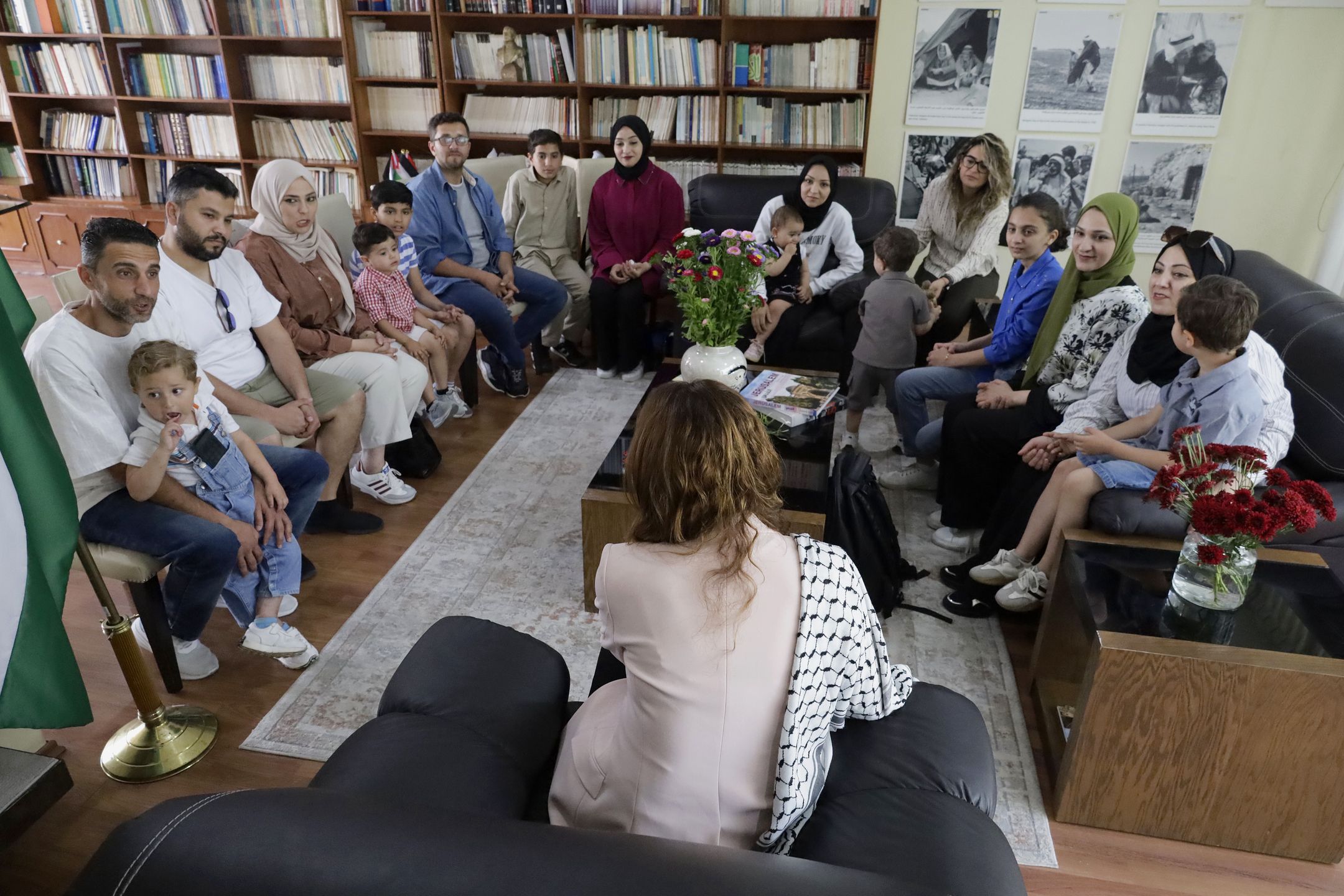Nadya Rasheed (salmon-colored jacket), Palestinian ambassador to Mexico, stands with members of the Abed family, refugees in Mexico City, Mexico, on June 10, 2025, who a few days ago still live under attack by the Israeli army in the Gaza Strip. (Photo by Gerardo Vieyra/NurPhoto via Getty Images)