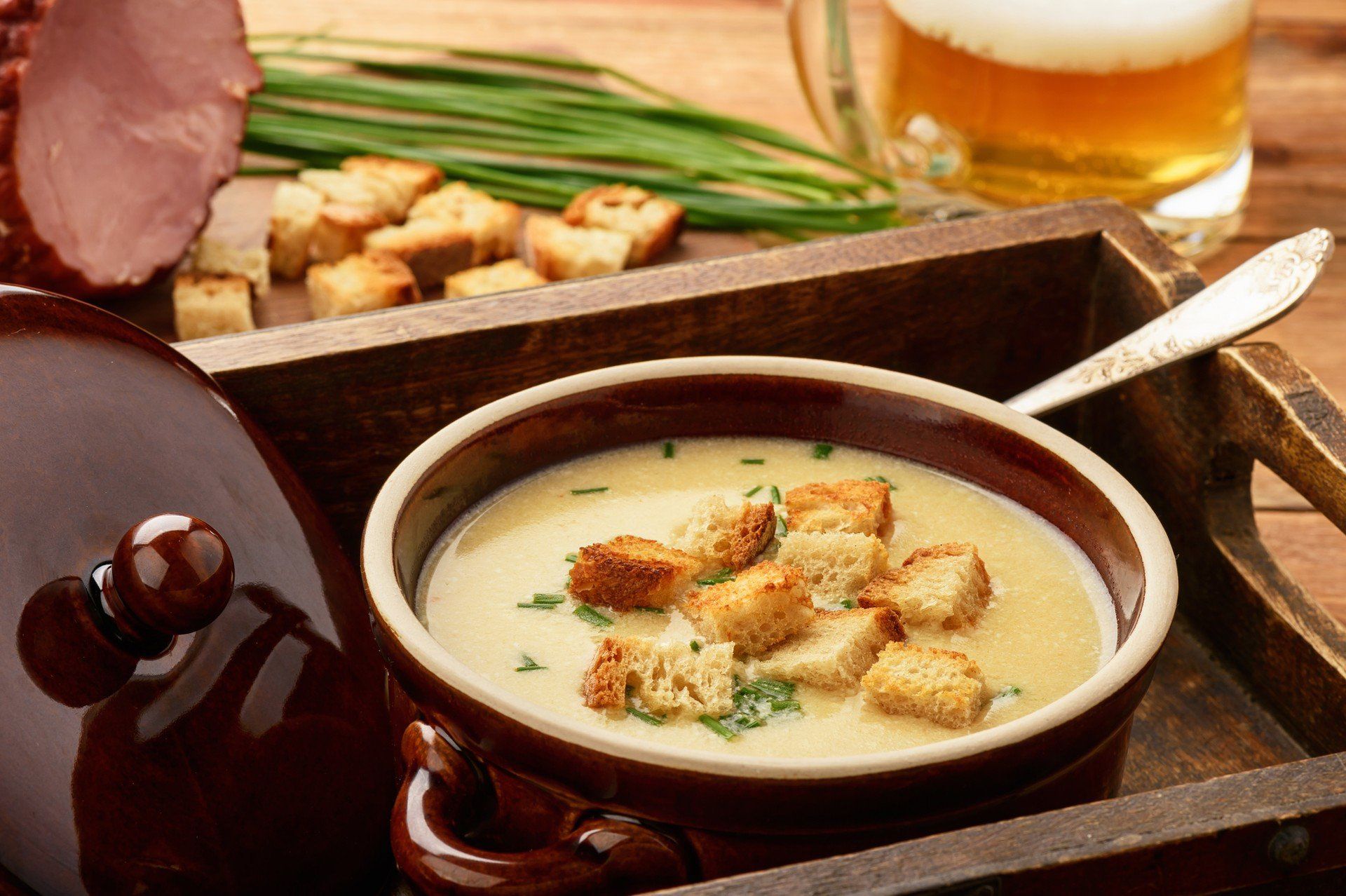 Beer cream soup with chicken fillet, ham and cheese.