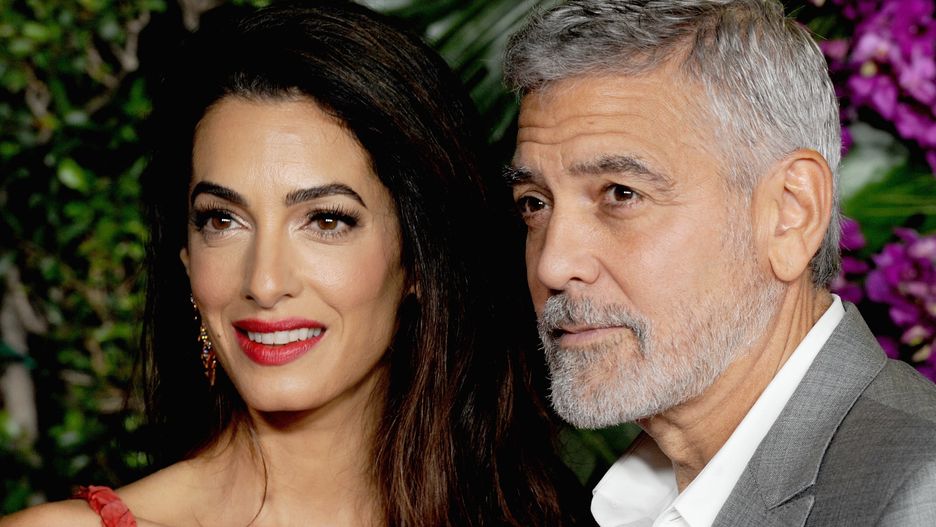 LOS ANGELES, CA - OCTOBER 17:  George Clooney and his wife Amal Clooney attend the premiere of Universal Pictures' "Ticket To Paradise" held at Regency Village Theatre on October 17, 2022 in Los Angeles, California.  (Photo by Albert L. Ortega/Getty Images)