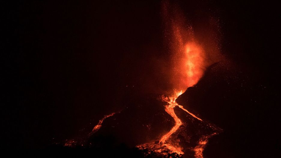 TemporaryThe Cumbre Vieja volcano, pictured from the port of Tazacorte, spews lava, ash and smoke, in the Canary Island of La Palma in October 3, 2021. - A new flow of highly liquid lava emerged from the volcano erupting in Spain's Canary islands on October 1, authorities said, as a huge magma shelf continues to build on the Atlantic ocean. (Photo by JORGE GUERRERO / AFP)JORGE GUERRERO