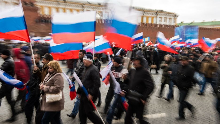 Rado?? na placu Czerwonym po przy??czeniu Krymu do RosjiPro-Kremlin activists rally at the Red Square in Moscow, on March 18, 2014, to celebrate the incorporation of Crimea. President Vladimir Putin pushed today every emotional button of the collective Russian psyche as he justified the incorporation of Crimea, citing everything from ancient history to Russia's demand for respect to Western double standards. AFP PHOTO / DMITRY SEREBRYAKOVDMITRY SEREBRYAKOV