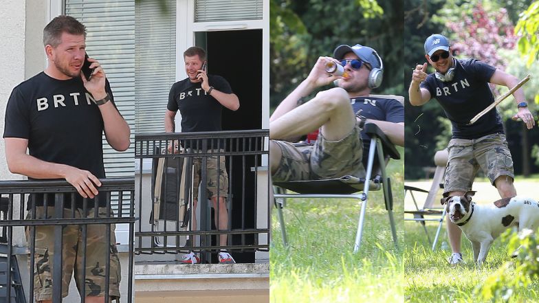 Filip Chajzer rozmawia przez telefon na balkonie nowego mieszkania i relaksuje się w parku