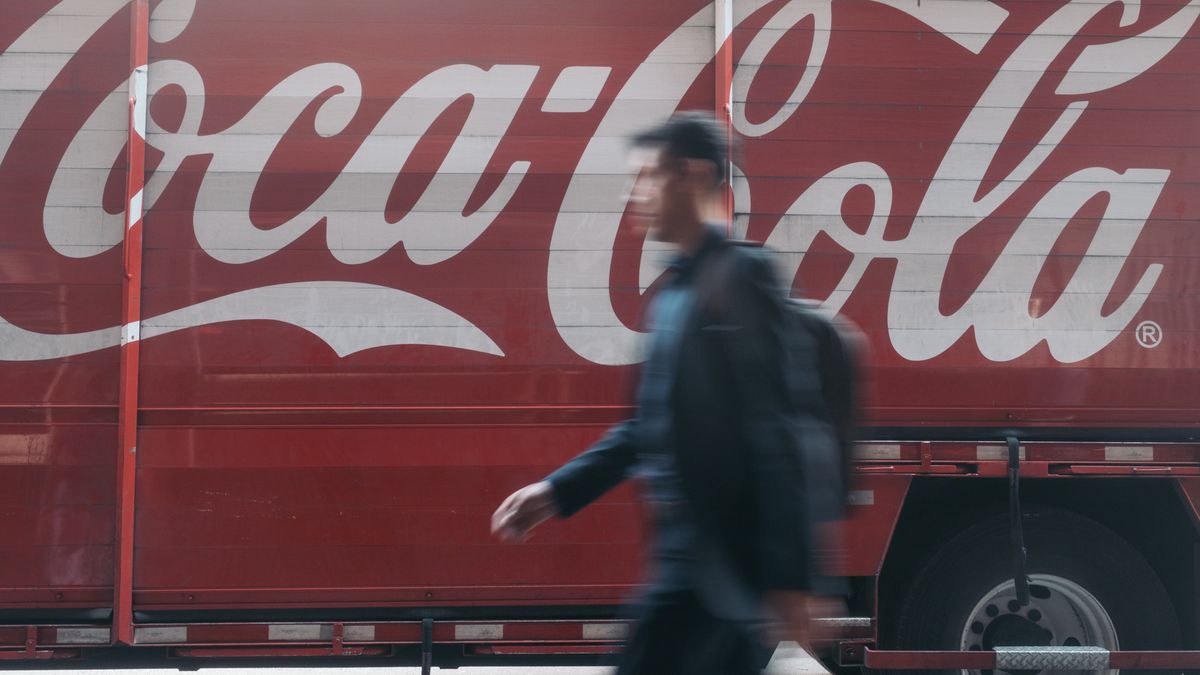 A pedestrian passes a Coca-Cola delivery truck in Mexico City, Mexico, on Wednesday, Jan. 25, 2023. The Latin American soft-drink market (all channels) grew 6% in 2022 to $128 billion. Off-trade channels accounted for 66% of the total vs. 68% in 2021. Photographer: Jeoffrey Guillemard/Bloomberg via Getty Images
