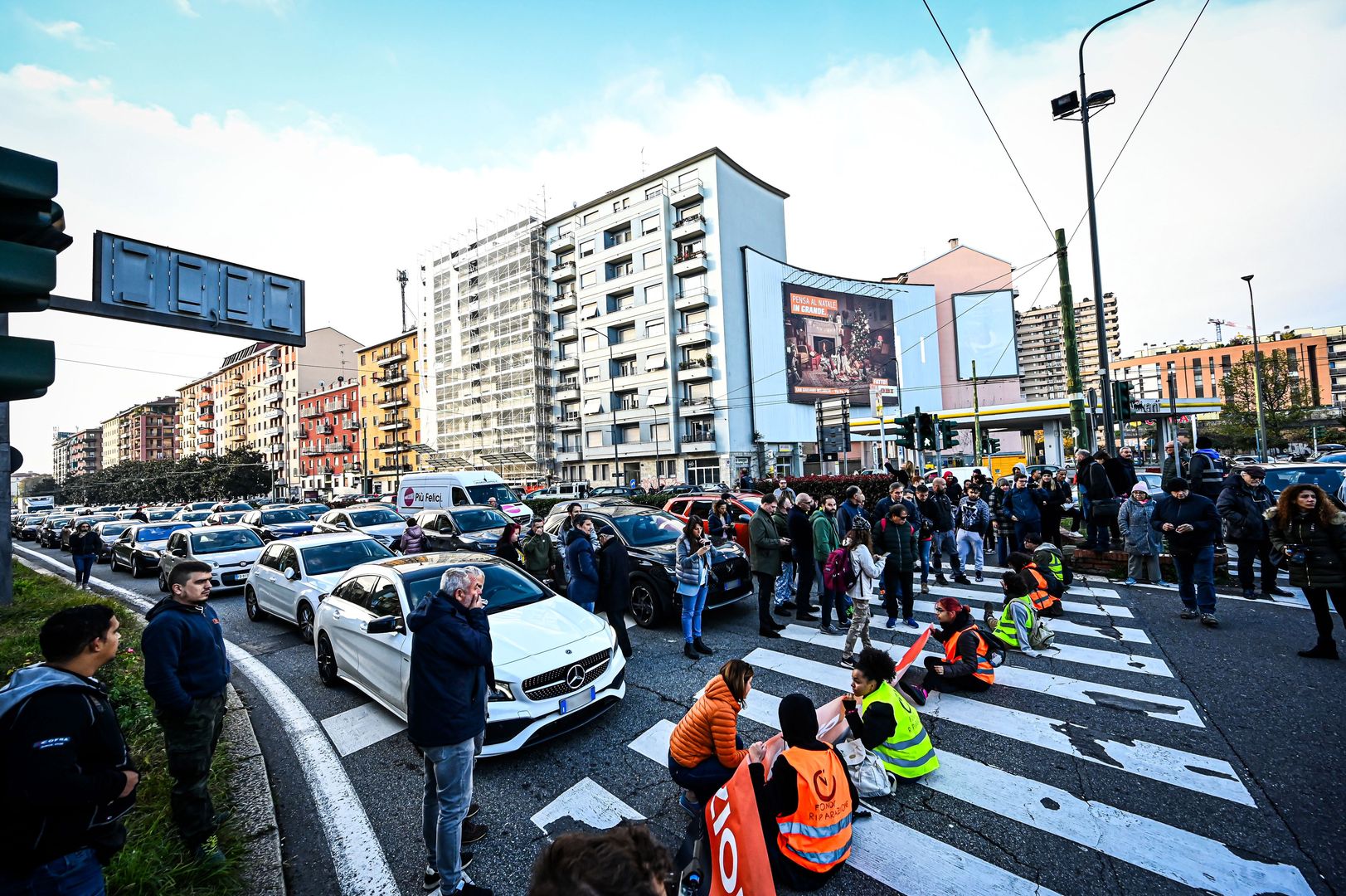MILAN, ITALY - NOVEMBER 13: Environmental activists by Ultima Generazione block the traffic to raise awareness on climate change in Milan, Italy on November 13, 2023 (Photo by Piero Cruciatti/Anadolu via Getty Images)