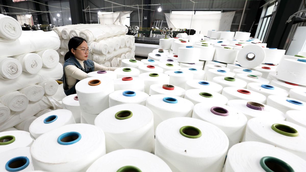 HUAIBEI, CHINA - NOVEMBER 16: An employee works on the production line at a textile factory November 16, 2024 in Huaibei, Anhui Province of China. (Photo by Li Xin/VCG via Getty Images)
