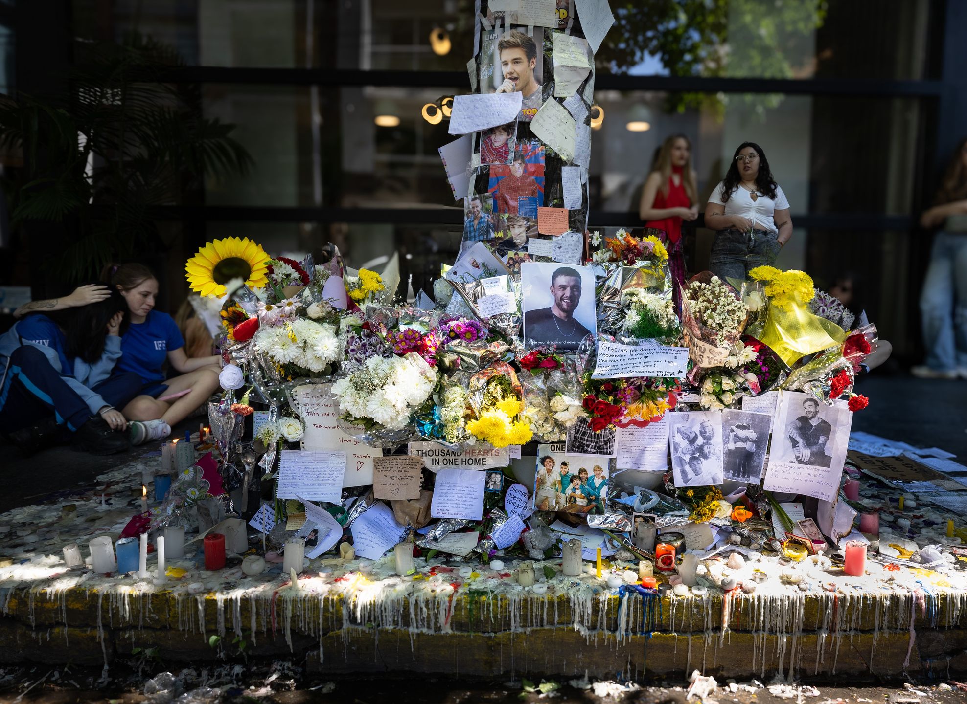 BUENOS AIRES, ARGENTINA - 2024/10/18: Altar is erected by Liam Payne's fans at the door of the Casa Sur Hotel in the Palermo neighborhood as a tribute. Geoff Payne, Liam's father, arrives at the Casa Sur hotel in the Palermo neighborhood where his son died, after having been at the morgue to identify the body. Fans set up an altar at the door of the hotel where the young 31-year-old musician was staying to pay tribute to him. (Photo by Rosana Alvarez Mullner/SOPA Images/LightRocket via Getty Images)