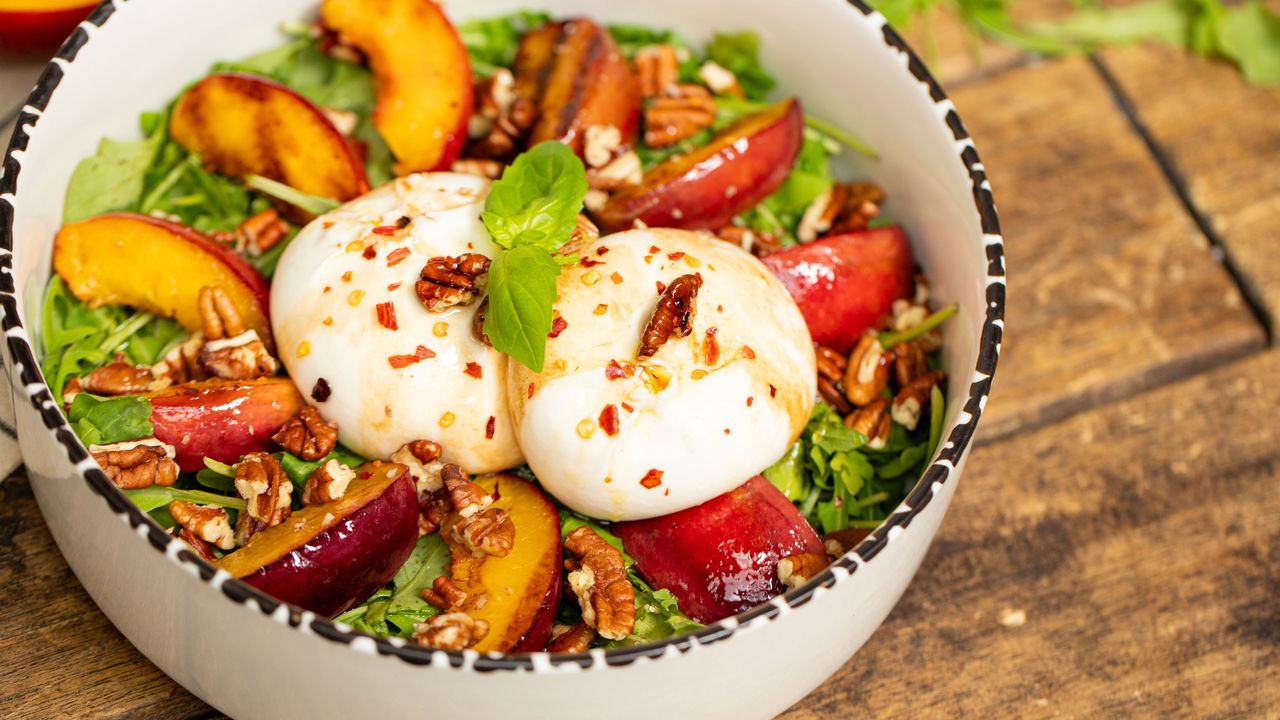 Salad sensation: Burrata and nectarine delight with arugula and pecans