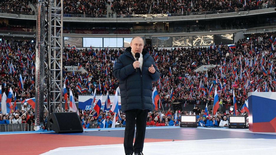 TemporaryRussian President Vladimir Putin gives a speech at a concert marking the eighth anniversary of Russia's annexation of Crimea at the Luzhniki stadium in Moscow on March 18, 2022. (Photo by Ramil SITDIKOV / POOL / AFP)RAMIL SITDIKOV