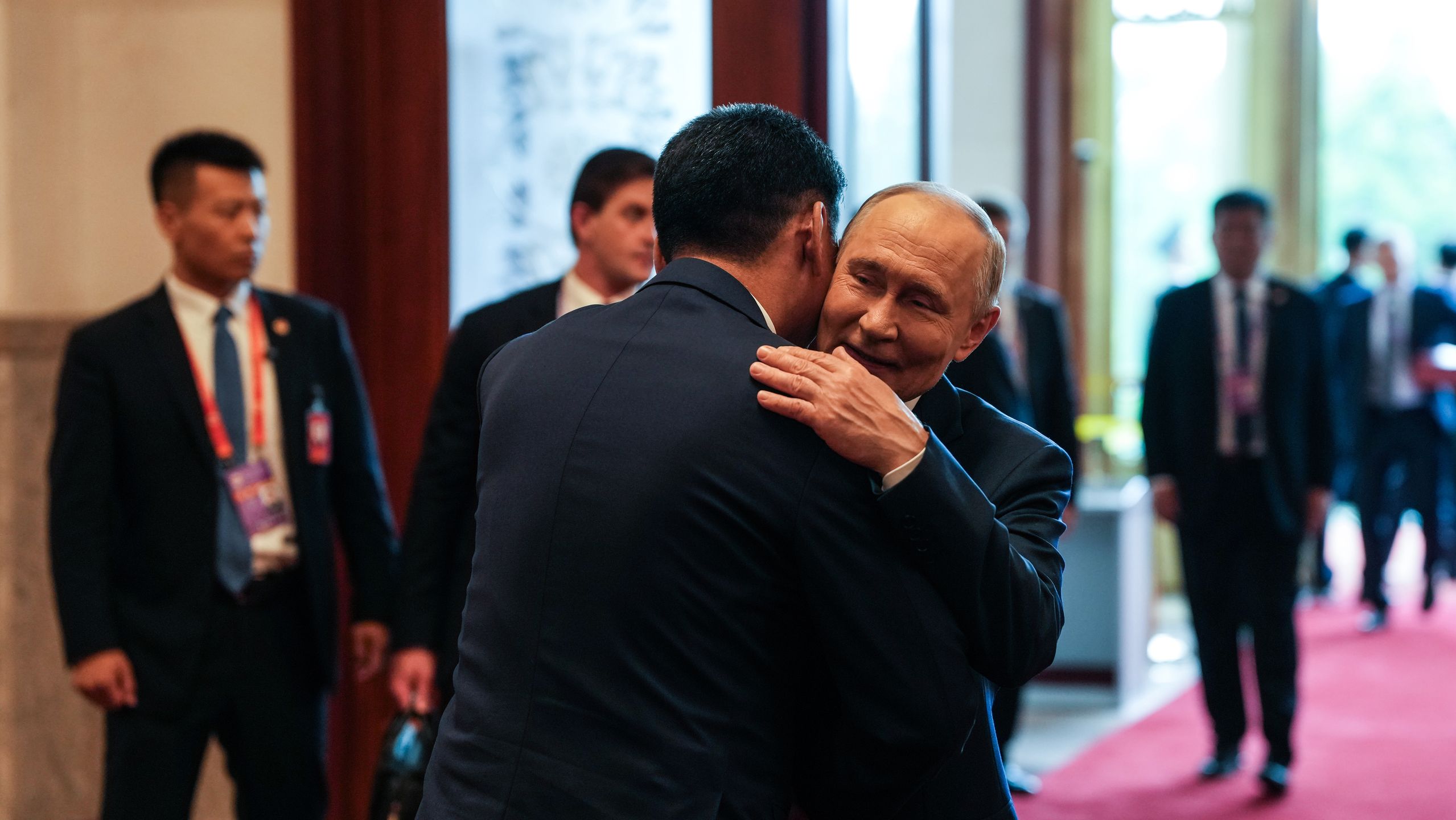 BEIJING, CHINA - SEPTEMBER 02: Russian President Vladimir Putin greets Mongolian President Ukhnaa Khurelsukh prior to a trilateral meeting with Chinese President Xi Jinping (not pictured) at the Great Hall of the People on September 2, 2025 in Beijing, China. (Photo by VCG/VCG via Getty Images)