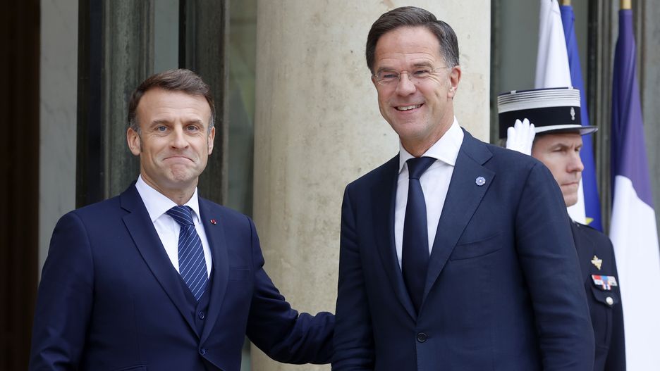 PARIS, FRANCE - NOVEMBER 12: French President Emmanuel Macron (L) welcomes NATO Secretary General Mark Rutte, as he arrives for a meeting at the Elysee Palace, on November 12, 2024 in Paris, France. This visit will be the first meeting of the Head of State with Mark Rutte in his new role as Secretary General of NATO, which the latter took up on October 1, 2024. During this meeting, they will discuss together the challenges facing the Alliance, and in particular support for Ukraine. (Photo by Chesnot/Getty Images)