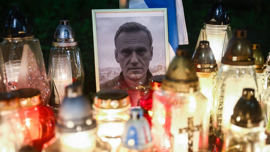 Flowers and candles are seen in a tribute to Alexei Navalny in front of the Russian Consulate General in Krakow, Poland on March 1st, 2024. Navalny, 47, Russian opposition politician, died on February 16th in the Russian prison about 40 miles north of the Arctic Circle, where he had been sentenced to 19 years. The funeral of Alexei Navalny took place today in Moscow where thousands of Russians came to pay their respects. (Photo by Beata Zawrzel/NurPhoto via Getty Images)