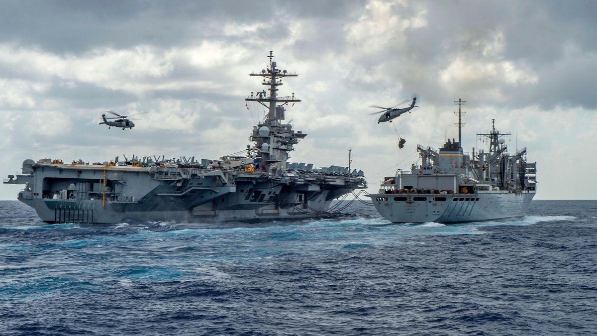 arch35
This handout picture released by the US Navy on May 8, 2019 shows the Nimitz-class aircraft carrier USS Abraham Lincoln (CVN 72) while conducting a replenishment-at-sea with the fast combat support ship USNS Arctic (T-AOE 9), while MH-60S Sea Hawk helicopters assigned to the "Nightdippers" of Helicopter Maritime Strike Squadron (HSM) 5, transfer stores between the ships. - The US is deploying an amphibious assault ship and a Patriot missile battery to bolster an aircraft carrier and B-52 bombers already sent to the Gulf, ratcheting up pressure on Iran. The USS Arlington, which transports marines, amphibious vehicles, conventional landing craft and rotary aircraft, and the Patriot air defence system will join the Abraham Lincoln carrier group, the Pentagon announced on May 10. (Photo by MCSN Jason Waite / Navy Office of Information / AFP)
MCSN JASON WAITE