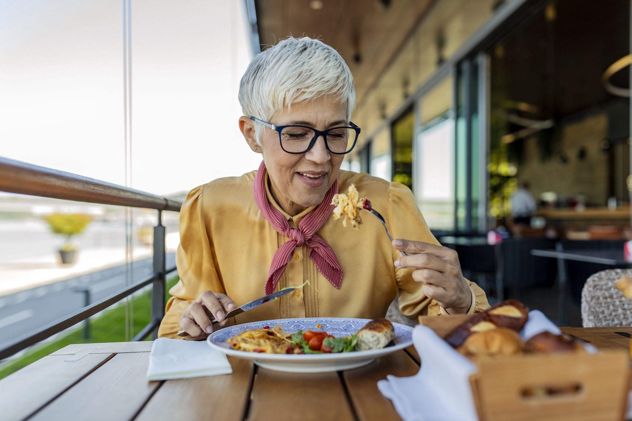 Mature Business Woman having lunch in a restaurant
Mature Businesswoman Having Working Lunch. Business people at lunch
RealPeopleGroup