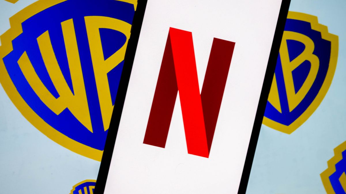 ANKARA, TURKIYE - DECEMBER 5: In this photo illustration, the logo of Netflix is displayed on a mobile phone screen in front of the logo of Warner Bros in Ankara, Turkiye on December 5, 2025. (Photo by Didem Mente/Anadolu via Getty Images)