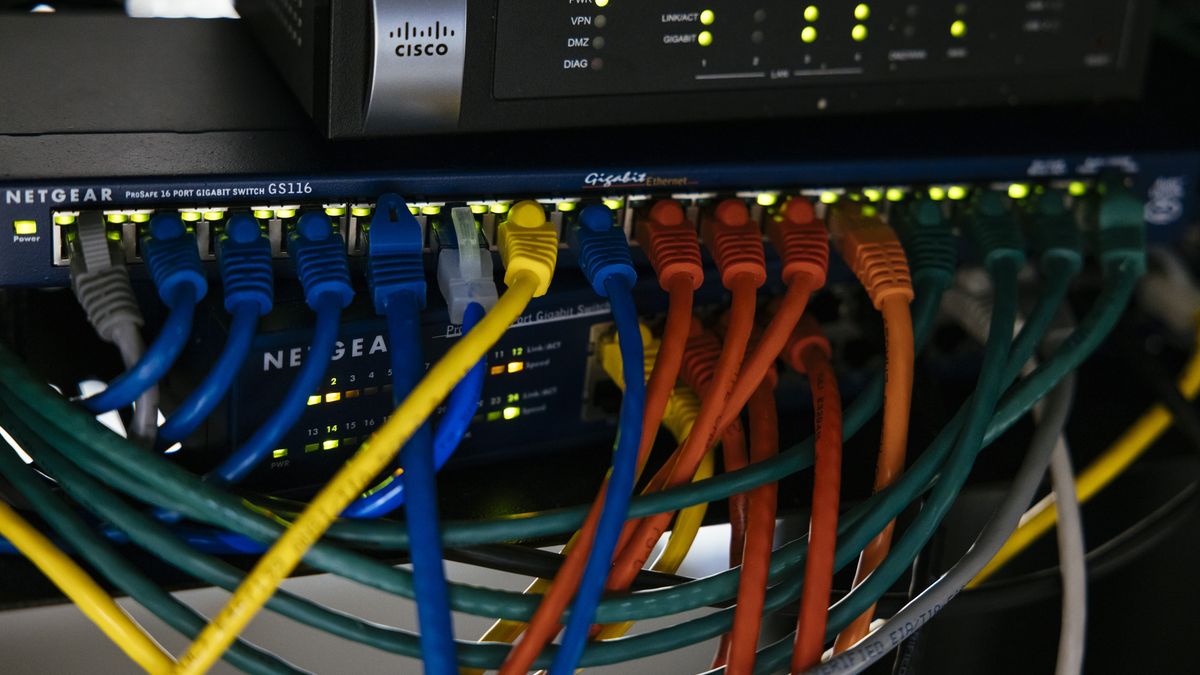 Ethernet cables plugged into a router at a quantum computing lab at the University of Chicago's Eckhardt Research Center in Chicago, Illinois, US, on Wednesday, Oct. 19, 2022. There is no cellular signal or wi-fi in the basement lab. Photographer: Taylor Glascock/Bloomberg via Getty Images