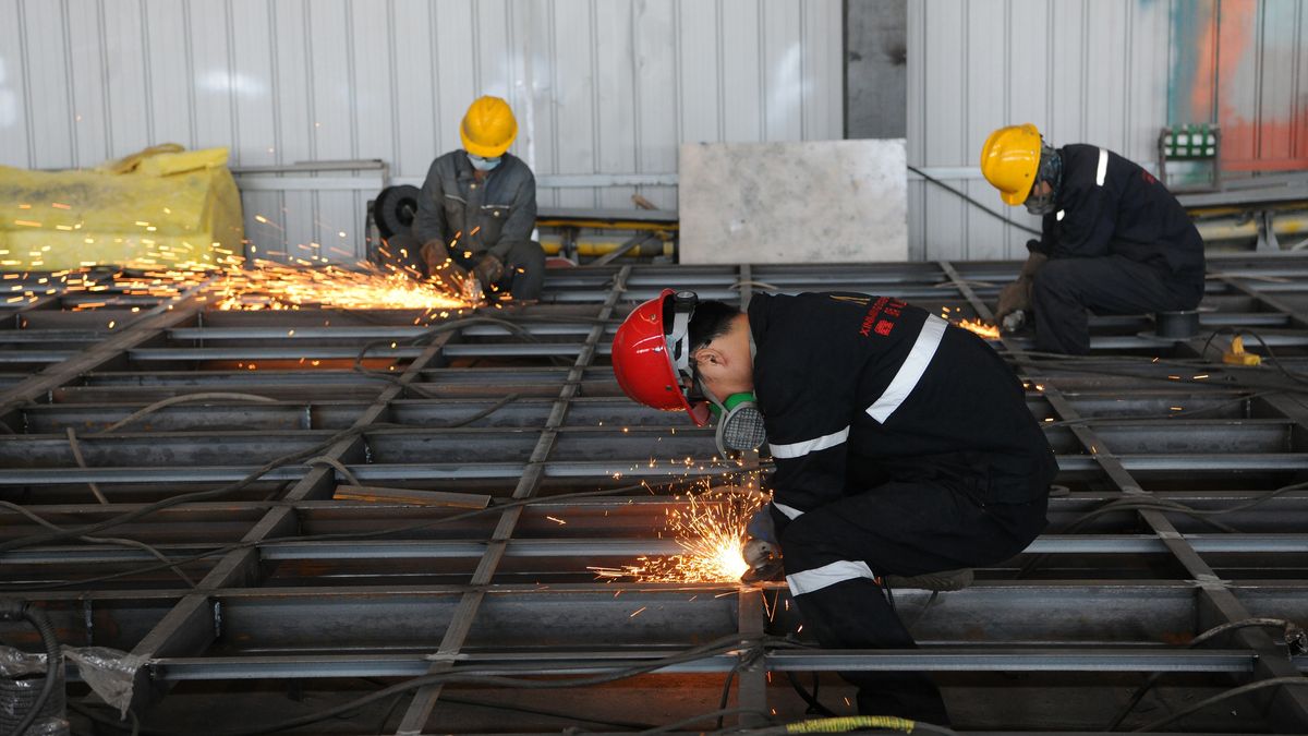 URUMQI, CHINA - MAY 28: Workers manufacture prefabricated cabin at an intelligent equipment technology enterprise on May 28, 2025 in Urumqi, Xinjiang Uyghur Autonomous Region of China. (Photo by VCG/VCG via Getty Images)