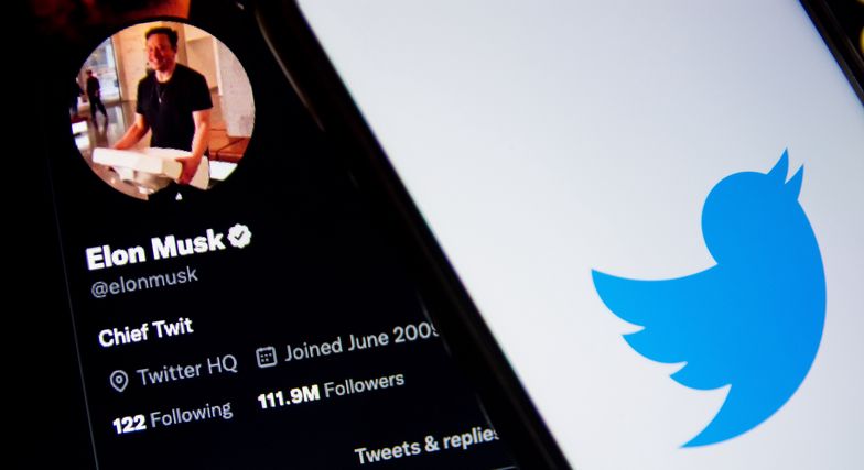 In this photo illustration a Twitter logo seen displayed on a smartphone screen with Elon Musk Twitter in the background in Athens, Greece on October 30, 2022. Elon Musk begins his Twitter ownership with firings. (Photo by Nikolas Kokovlis/NurPhoto via Getty Images)