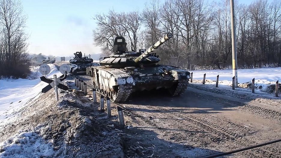 TemporaryThis handout video grab released by the Russian Defence Ministry on February 15, 2022, shows Russian tanks leaving for Russia after joint exercises of the armed forces of Russia and Belarus as part of an inspection of the Union State's Response Force, at a firing range near Brest. - Russia said on February 15, 2022 it was pulling back some of its forces near the Ukrainian border to their bases, in what would be the first major step towards de-escalation in weeks of crisis with the West. The move came amid an intense diplomatic effort to avert a feared Russian invasion of its pro-Western neighbour and after Moscow amassed more than 100,000 troops near Ukraine's borders. (Photo by Handout / Russian Defence Ministry / AFP) / RESTRICTED TO EDITORIAL USE - MANDATORY CREDIT "AFP PHOTO /  RUSSIAN DEFENCE MINISTRY" - NO MARKETING - NO ADVERTISING CAMPAIGNS - DISTRIBUTED AS A SERVICE TO CLIENTSHANDOUT