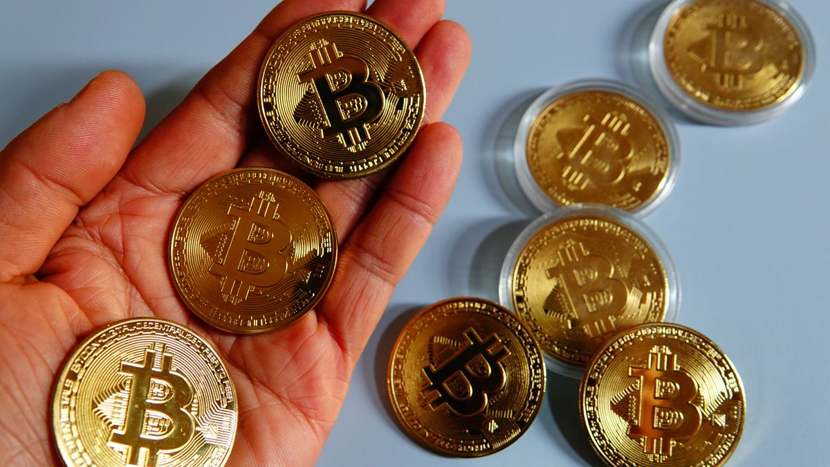 A netizen is displaying a physical commemorative bitcoin coin in Yichang, Hubei Province, China, on December 27, 2023. (Photo by Costfoto/NurPhoto via Getty Images)