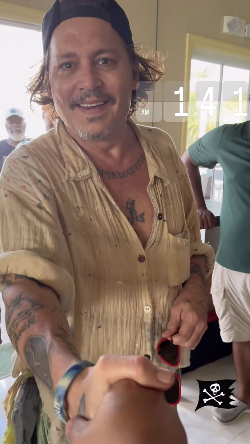 Johnny Depp showcased his new pearly white teeth