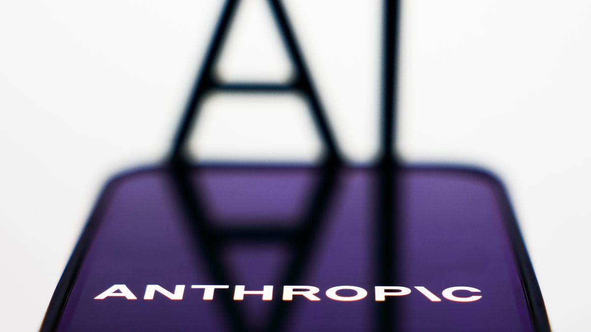 AI sign displayed on a screen and Anthropic logo displayed on a phone screen are seen in this illustration photo taken in Krakow, Poland on December 26, 2025. (Photo by Jakub Porzycki/NurPhoto via Getty Images)
